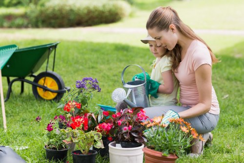 Gardener working in a Finsbury Park front garden tidy