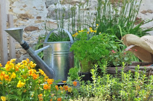 Workers wearing PPE while maintaining a residential garden